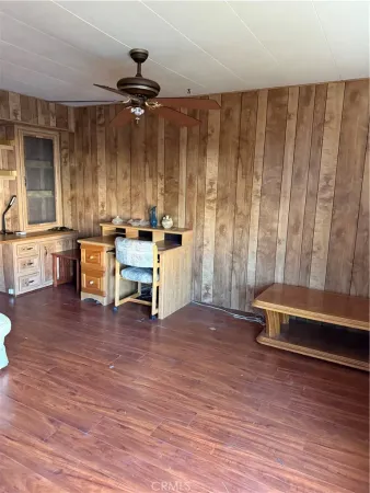 a view of a room with furniture window and wooden floor