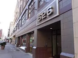 a view of a building with a street