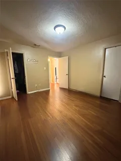 a view of a livingroom with furniture and wooden floor