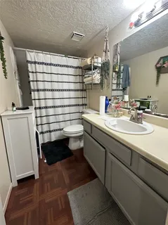 a kitchen with a sink and a stove top oven