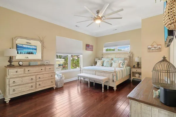 a bedroom with furniture and wooden floor