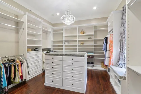 a kitchen with a refrigerator and a stove