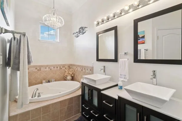a bathroom with a granite countertop toilet and a shower