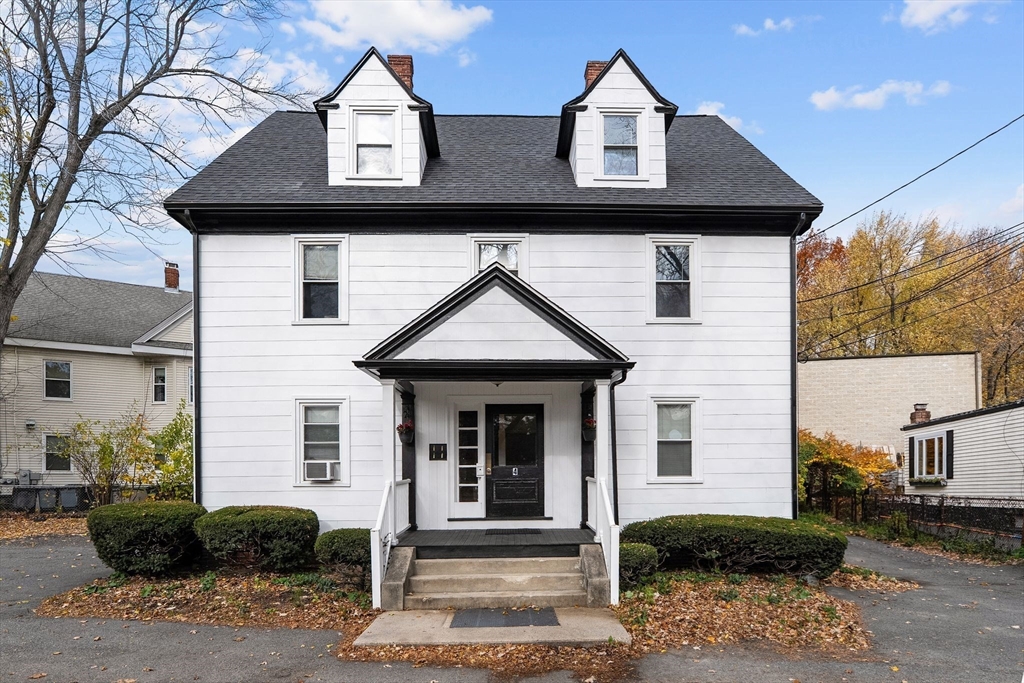 a front view of a house with garden
