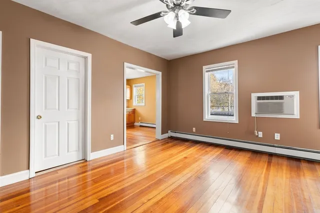 a view of livingroom with hardwood floor and ceiling fan