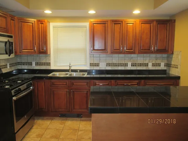 a kitchen with a sink and cabinets