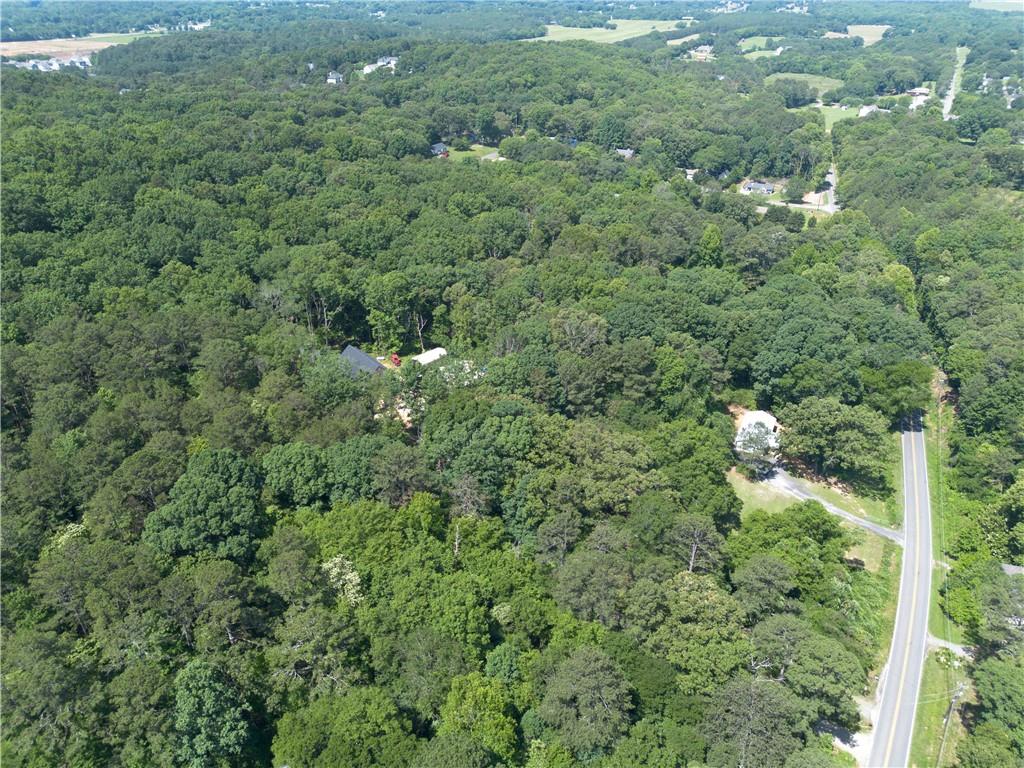 1217 Mission Road Southwest Cartersville, GA 30120 - Photo 18 of 18 a view of a forest with a houses