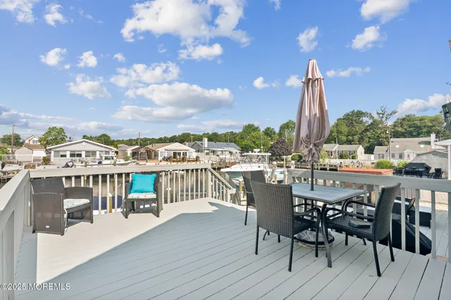 a view of a balcony with furniture