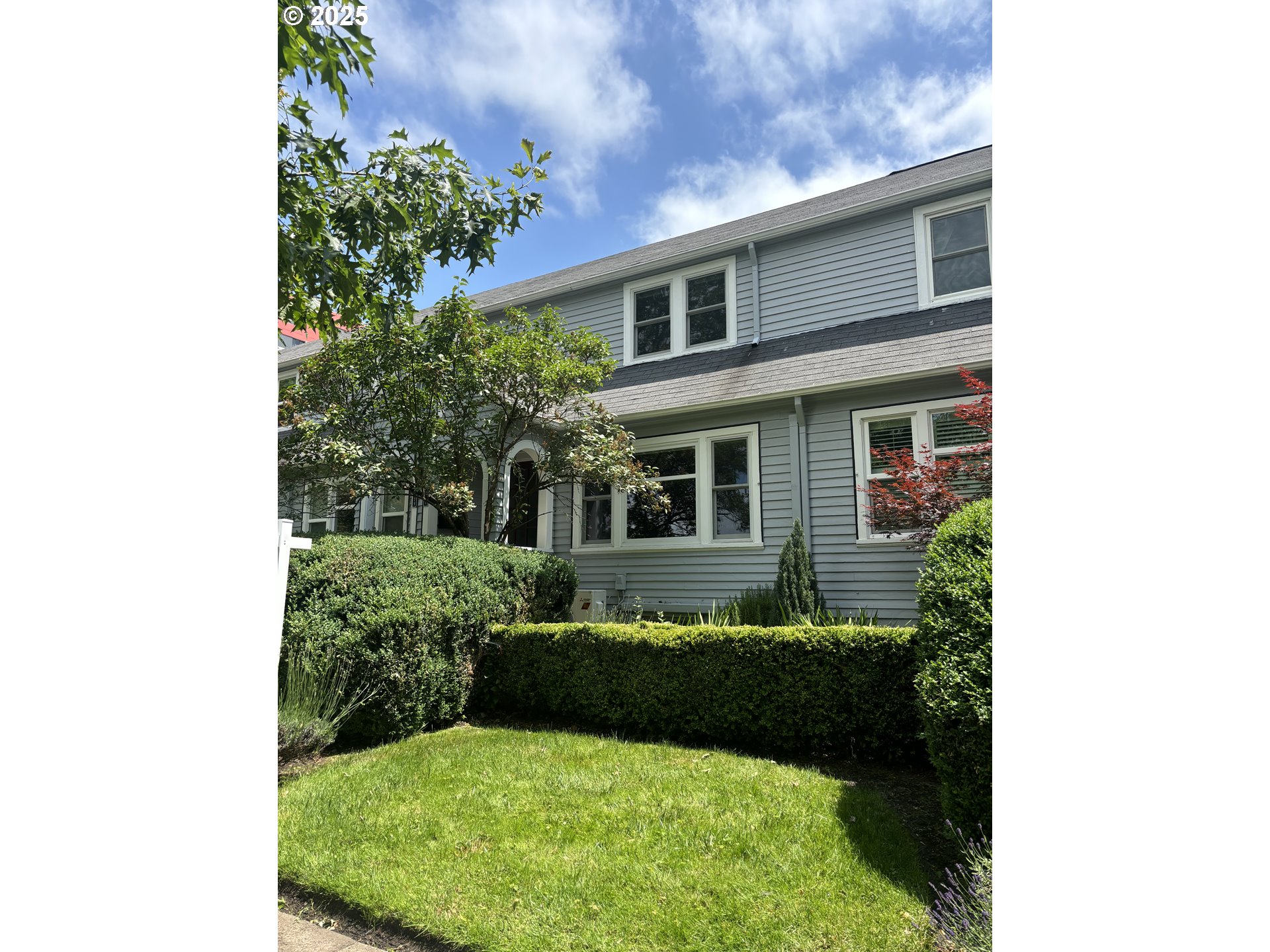 a view of a house with backyard sitting area and garden