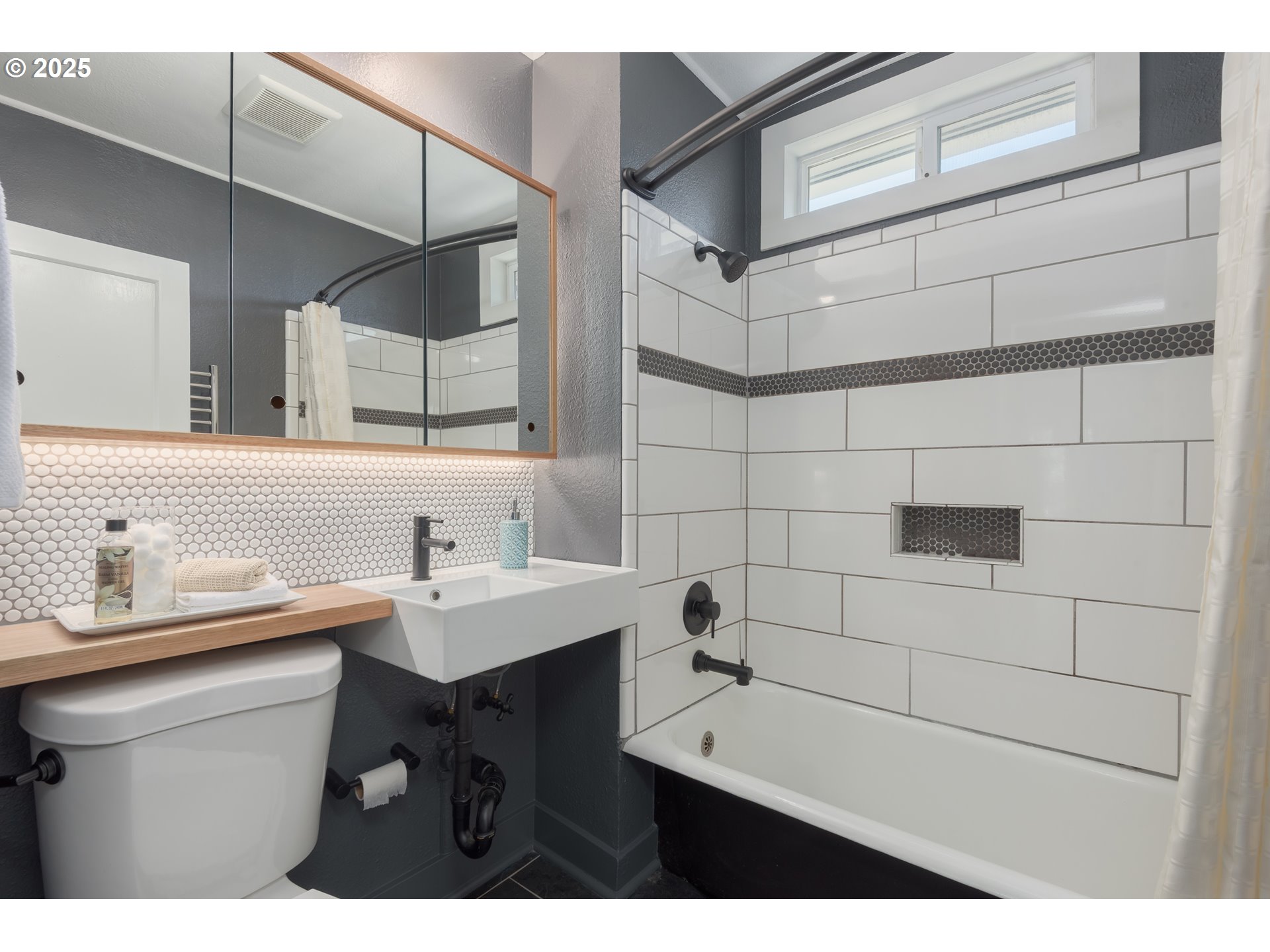 1681 Olive Street Eugene, OR 97401 - Photo 16 of 30 a bathroom with a sink and a mirror