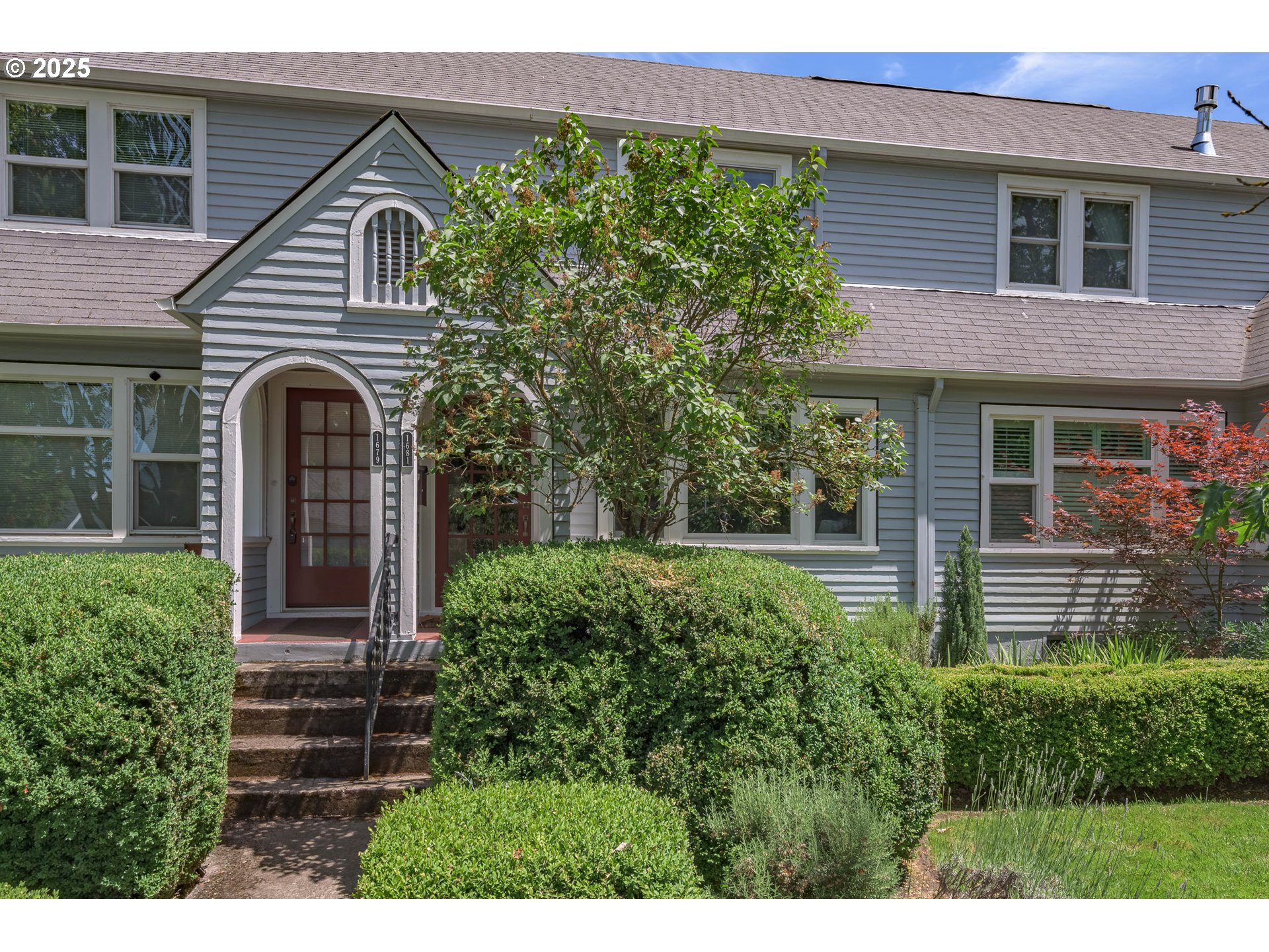 1681 Olive Street Eugene, OR 97401 - Photo 2 of 30 a front view of a house with garden