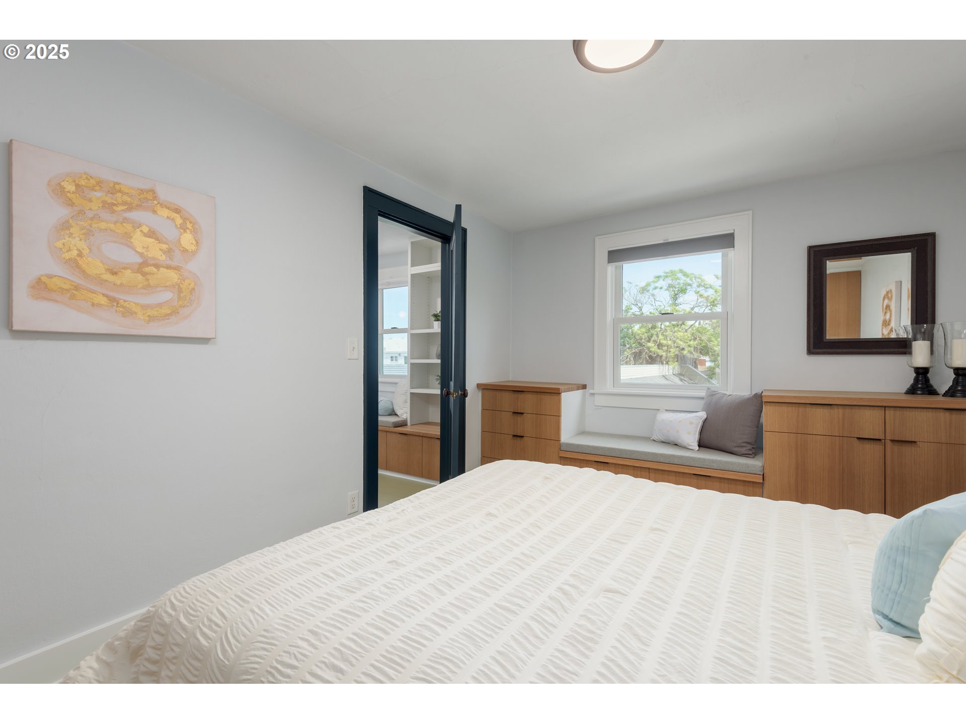 1681 Olive Street Eugene, OR 97401 - Photo 22 of 30 a bedroom with a bed and a view of kitchen