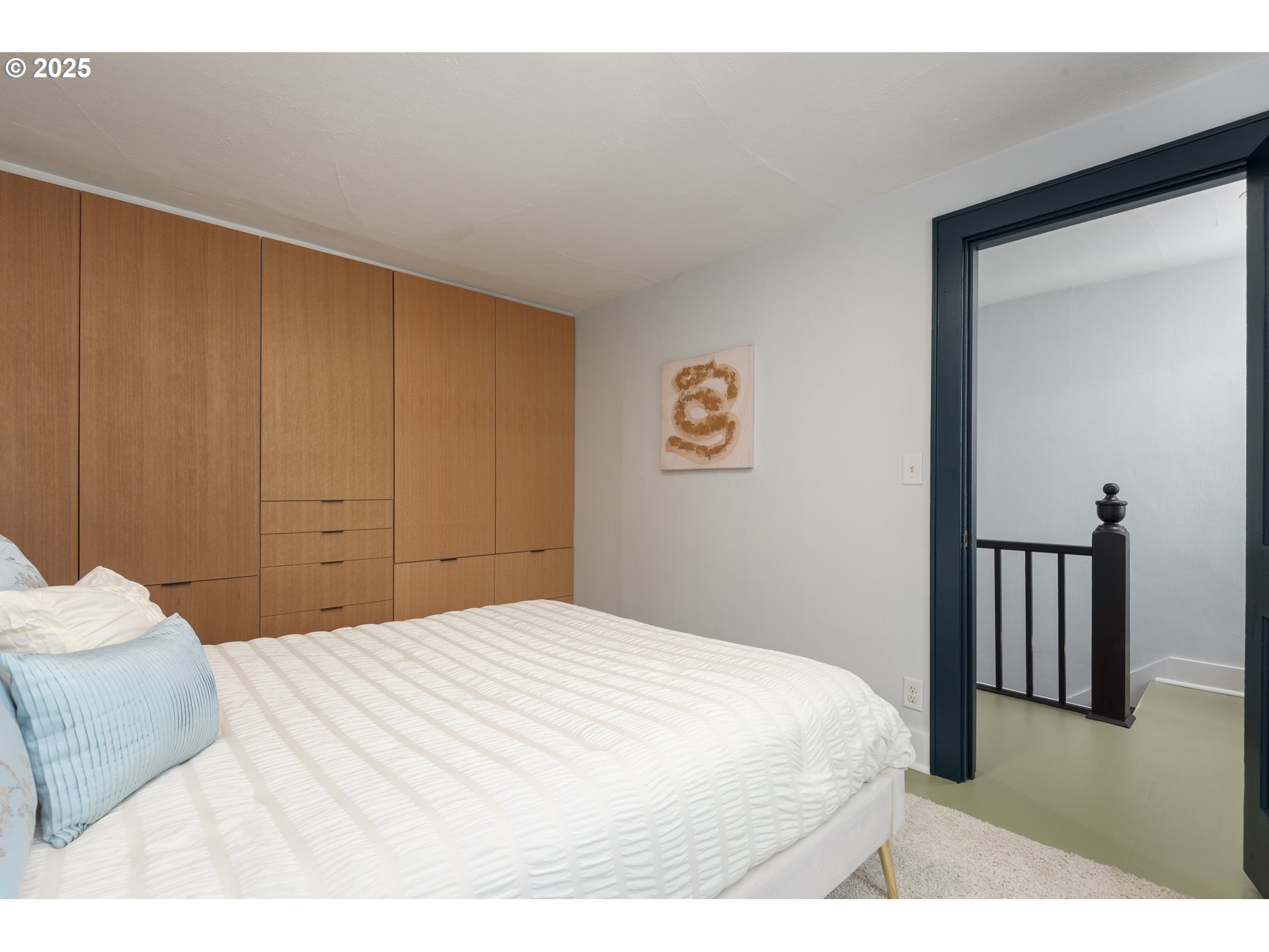 1681 Olive Street Eugene, OR 97401 - Photo 23 of 30 a bedroom with a bed and a painting on the wall