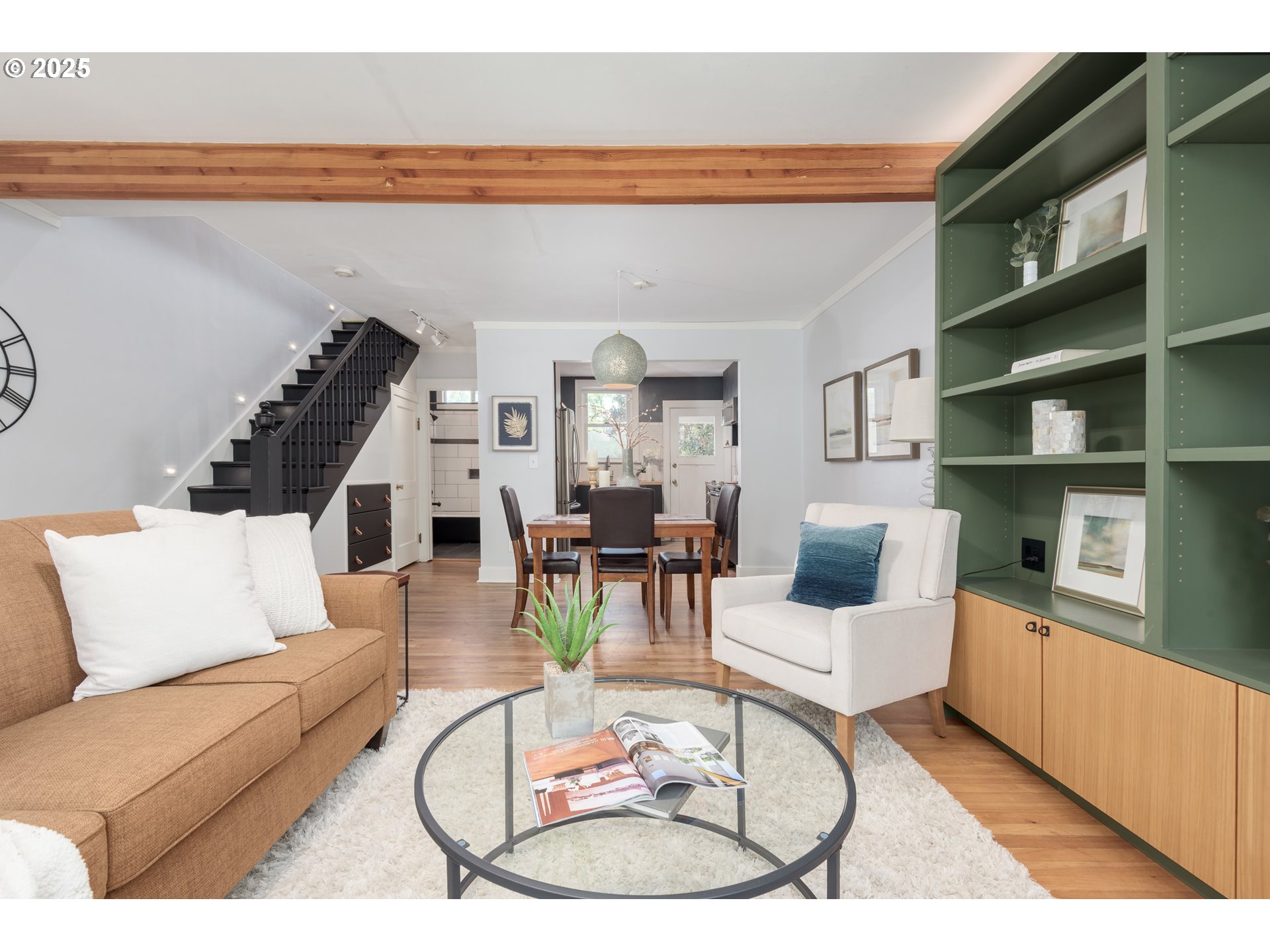 1681 Olive Street Eugene, OR 97401 - Photo 5 of 30 a living room with furniture a rug and white walls