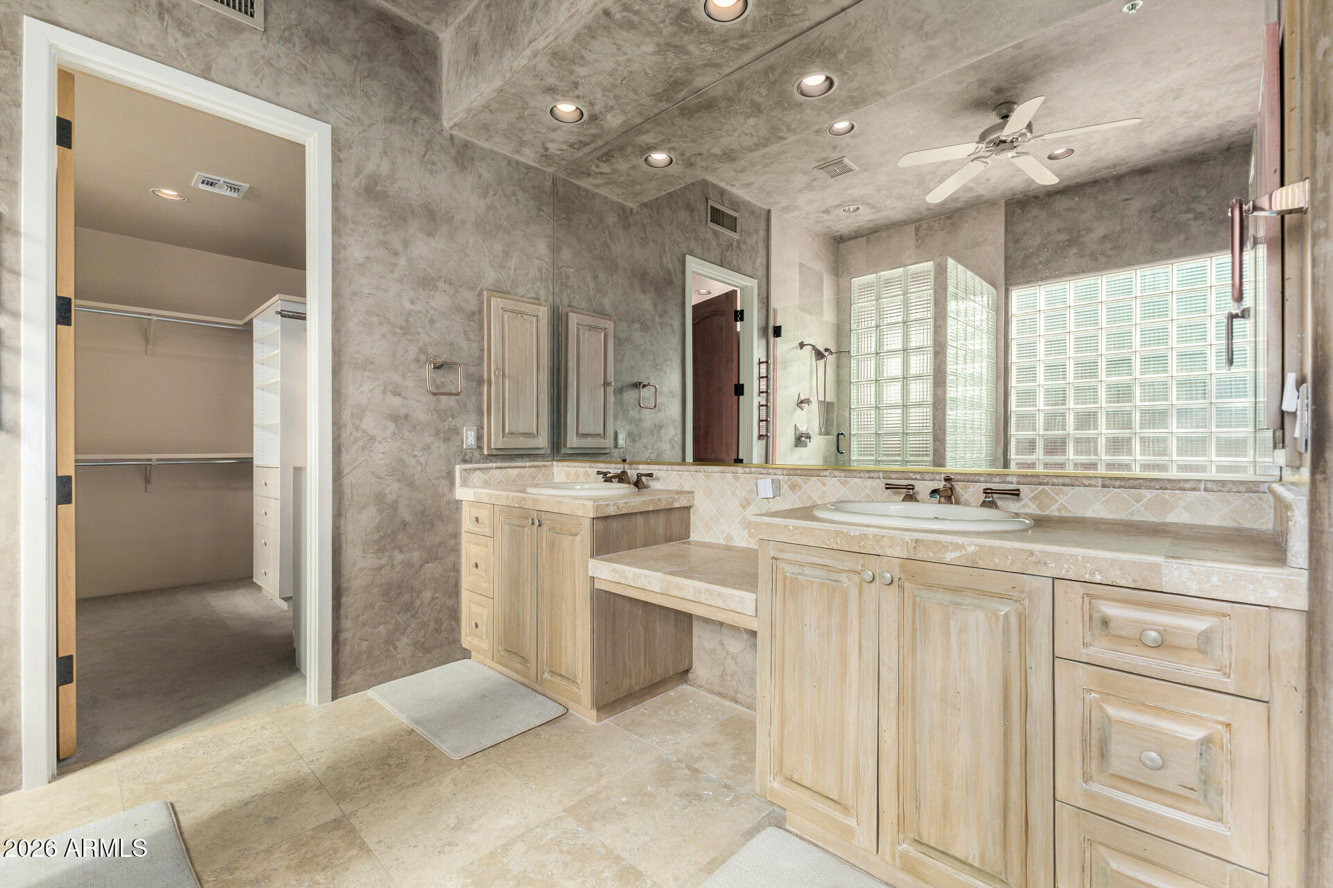 10040 East Happy Valley Road, Unit 2057 Scottsdale, AZ 85255 - Photo 11 of 21 a large bathroom with a double vanity sink a mirror and a shower