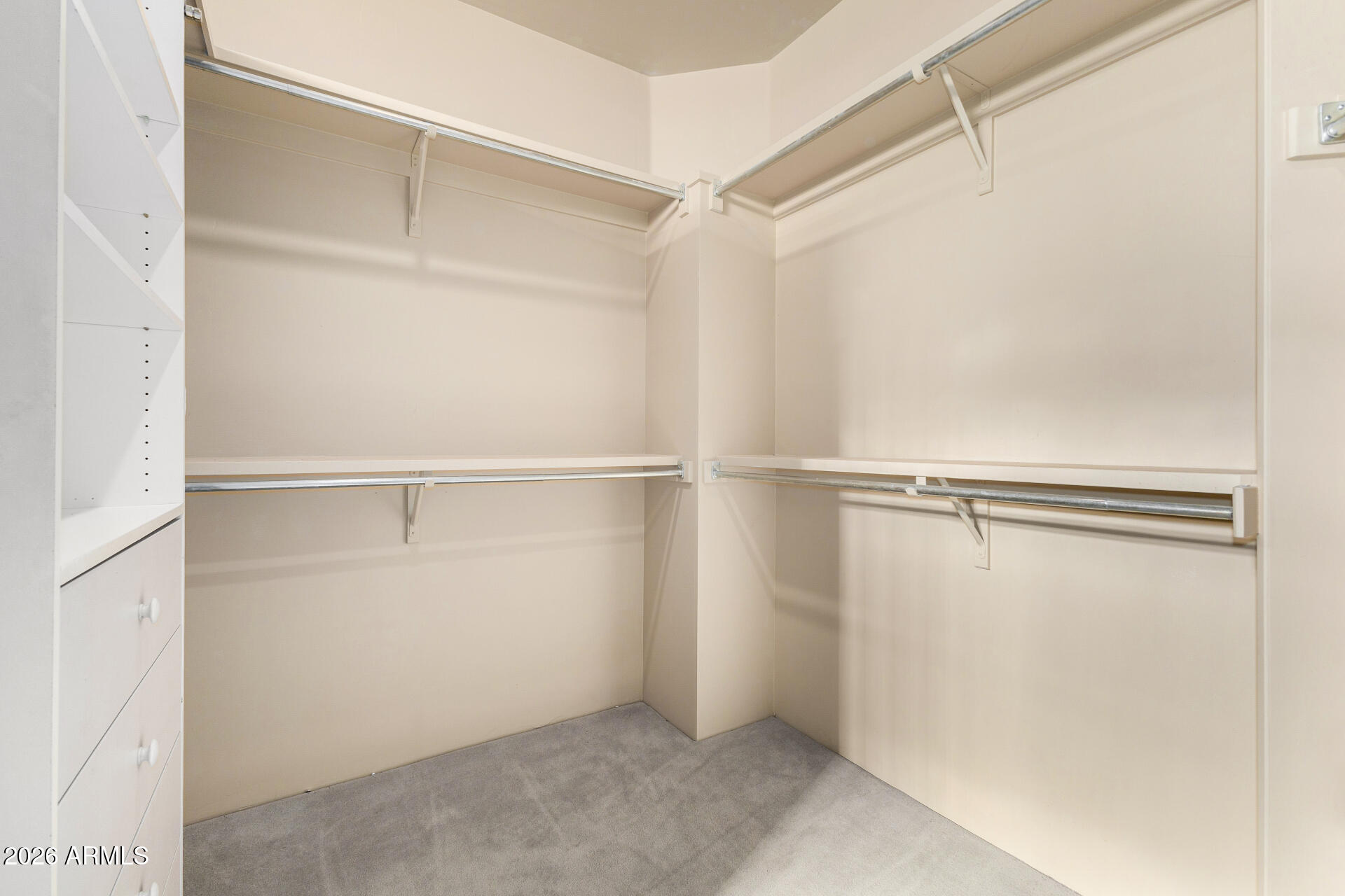 10040 East Happy Valley Road, Unit 2057 Scottsdale, AZ 85255 - Photo 13 of 21 a view of an empty walk in closet