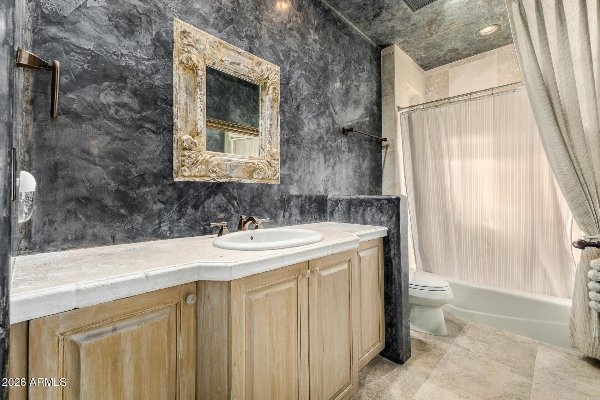 10040 East Happy Valley Road, Unit 2057 Scottsdale, AZ 85255 - Photo 16 of 21 a bathroom with a sink and a mirror
