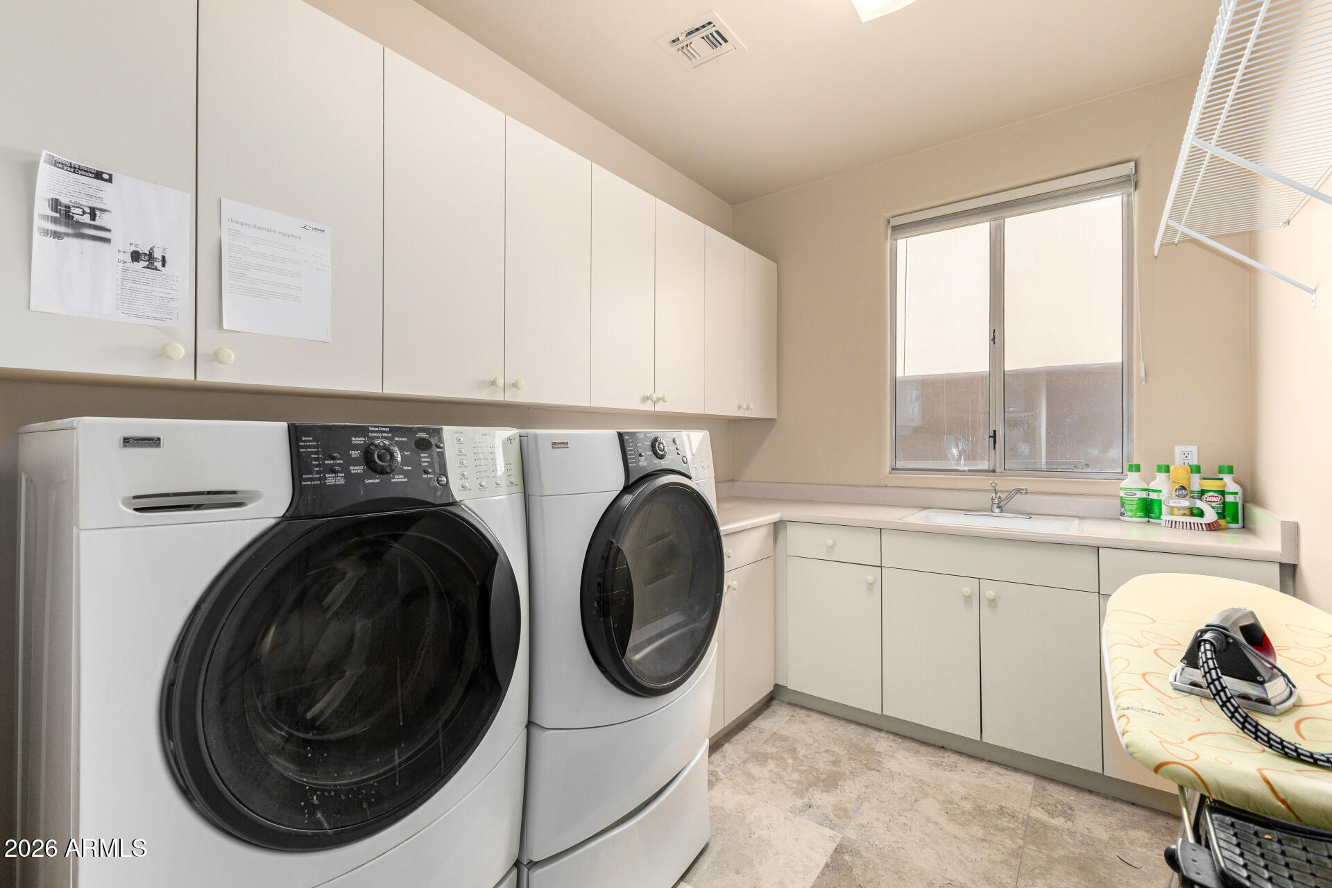 10040 East Happy Valley Road, Unit 2057 Scottsdale, AZ 85255 - Photo 18 of 21 a utility room with sink dryer and washer
