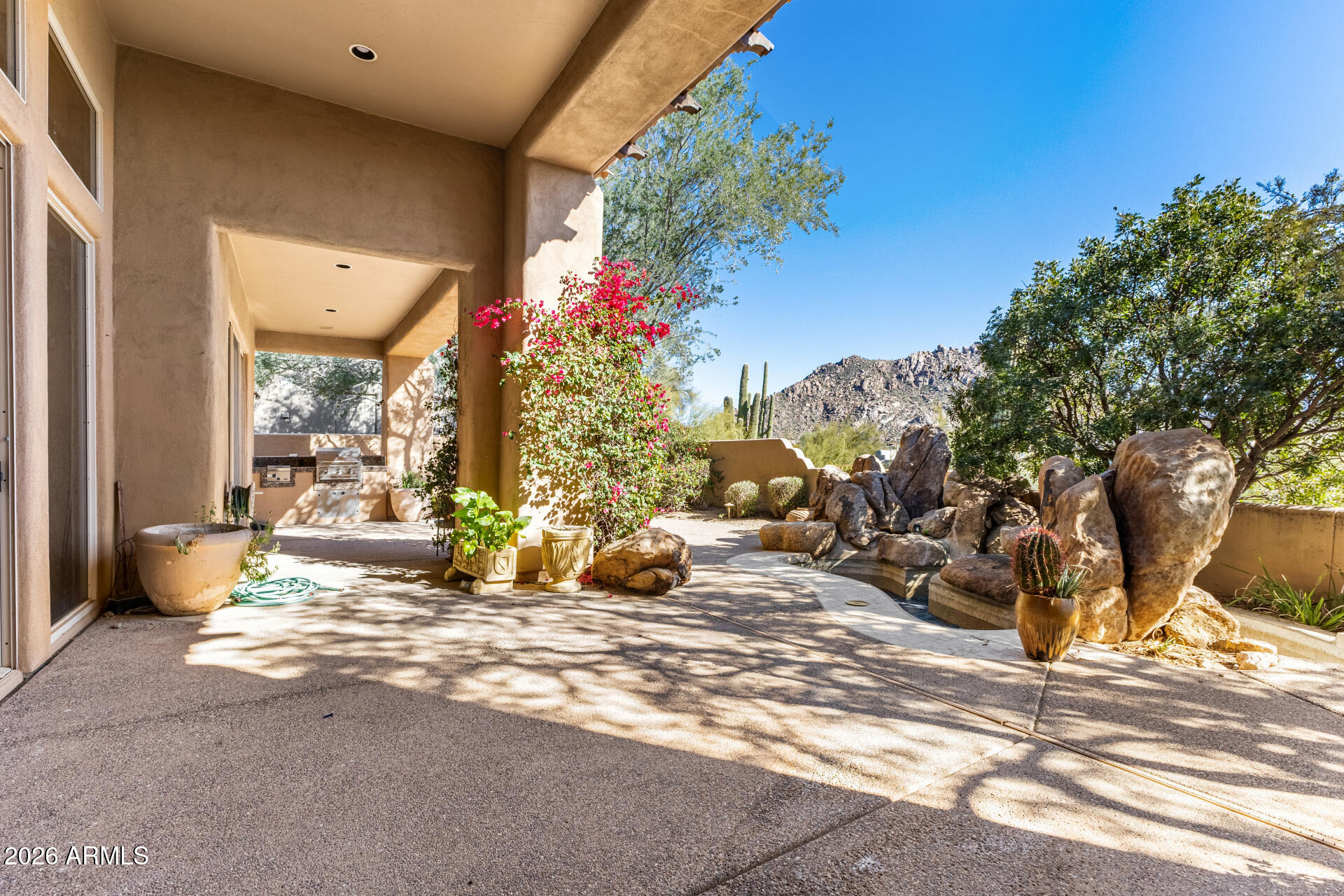10040 East Happy Valley Road, Unit 2057 Scottsdale, AZ 85255 - Photo 20 of 21 a view of a lobby with a tree