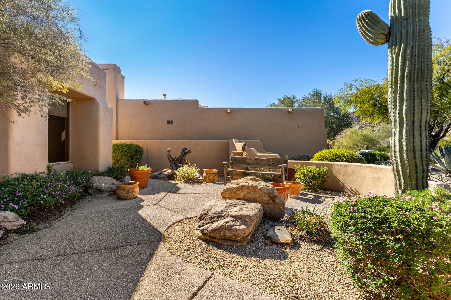 10040 East Happy Valley Road, Unit 2057 Scottsdale, AZ 85255 - Photo 2 of 21 a picture of a table and chairs in the patio