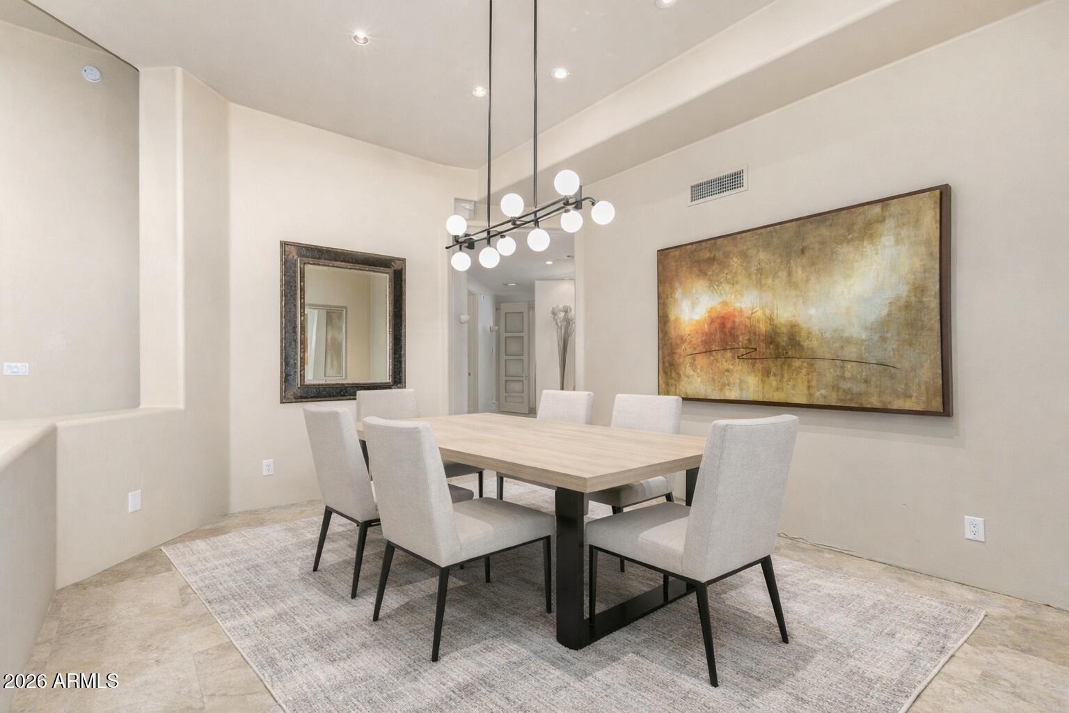 10040 East Happy Valley Road, Unit 2057 Scottsdale, AZ 85255 - Photo 5 of 21 a view of a dining room with furniture and a chandelier fan