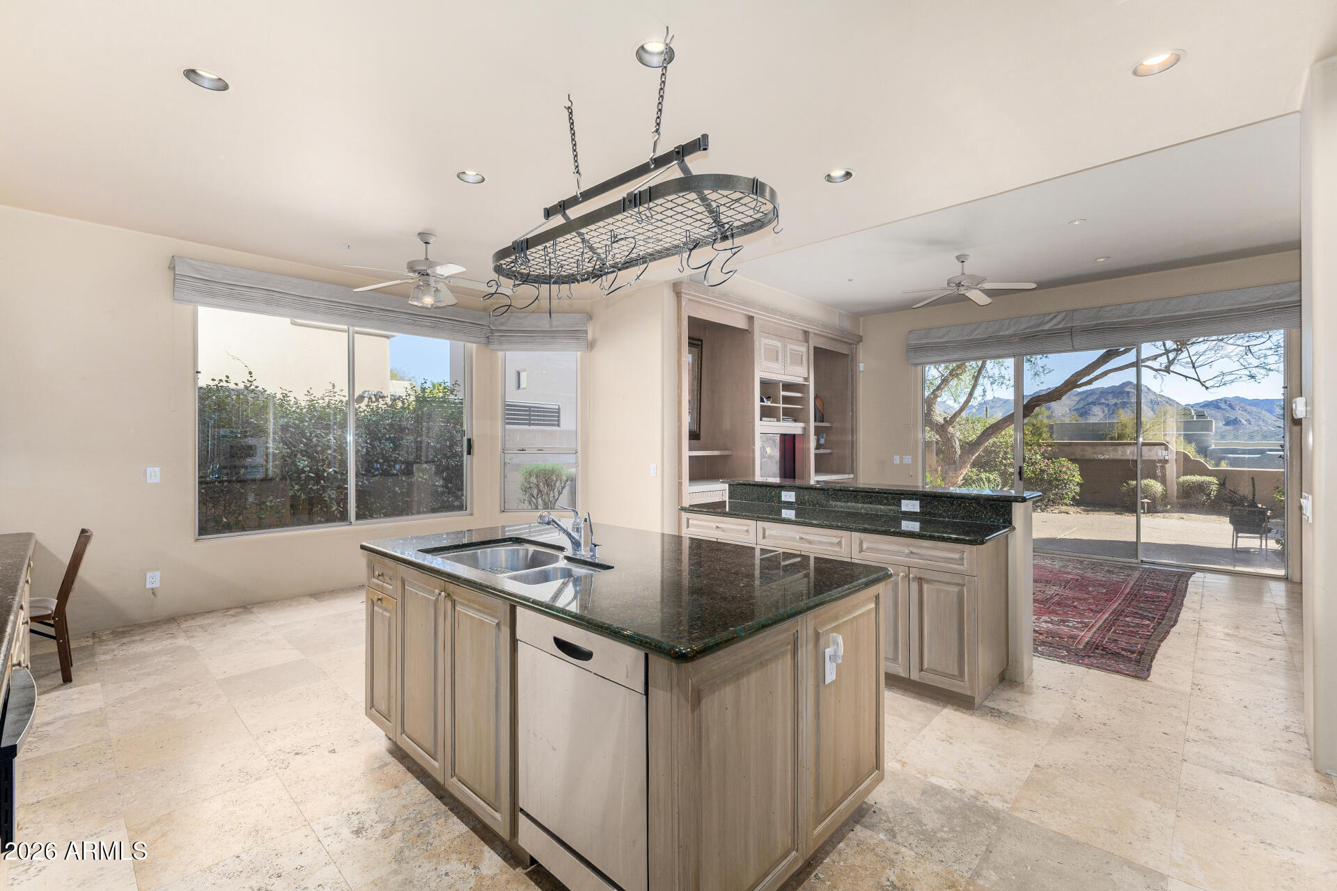 10040 East Happy Valley Road, Unit 2057 Scottsdale, AZ 85255 - Photo 8 of 21 a kitchen with stainless steel appliances granite countertop a sink and a stove