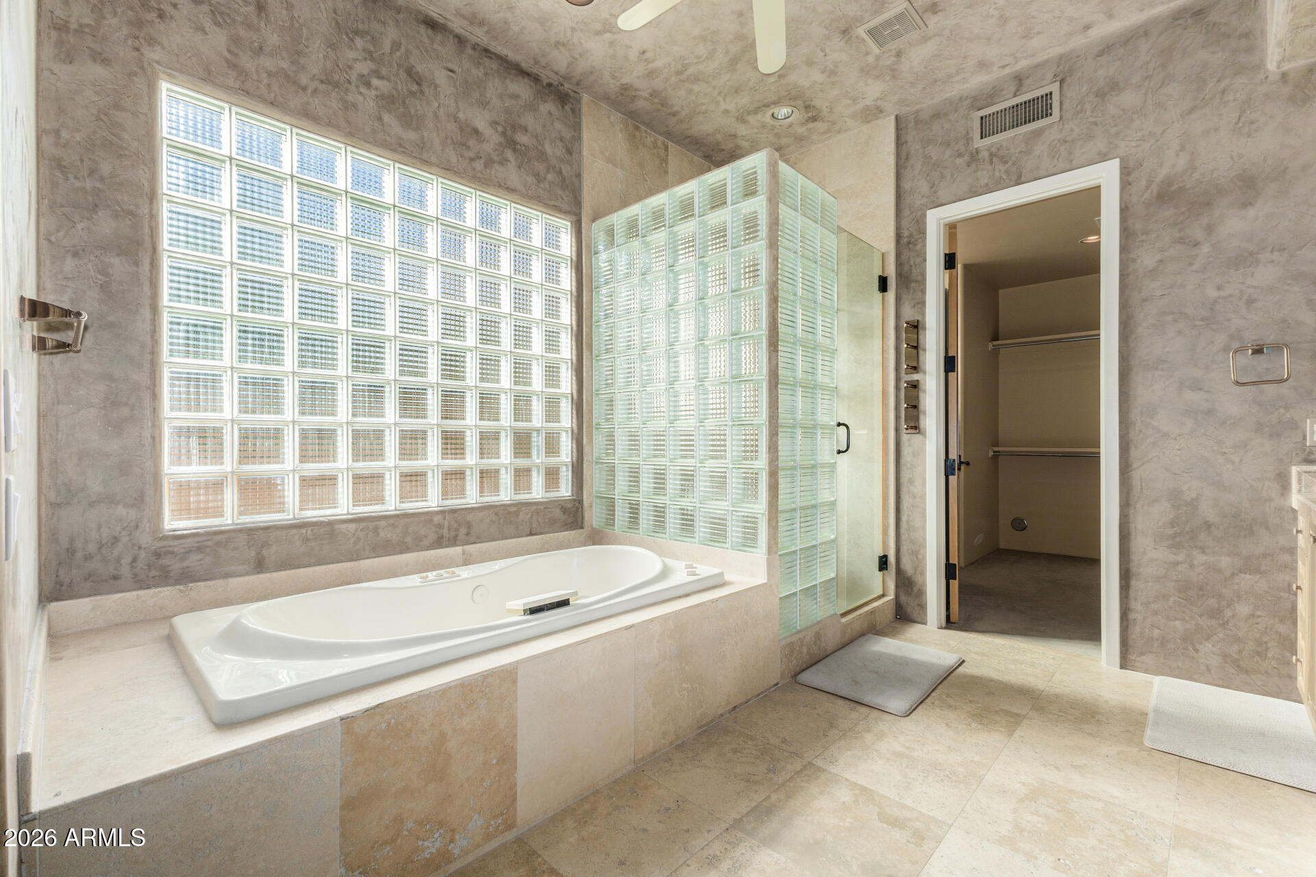 10040 East Happy Valley Road, Unit 2057 Scottsdale, AZ 85255 - Photo 10 of 21 a bathroom with a bathtub and a shower