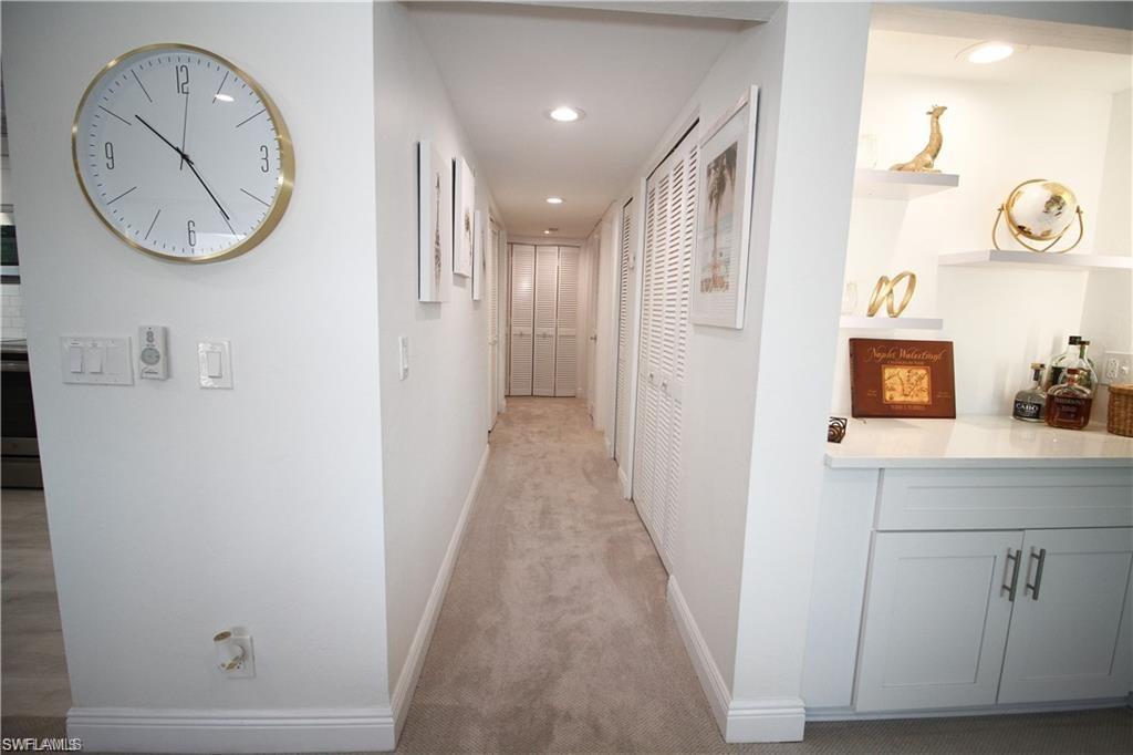 97 Georgetown Boulevard, Unit 97 Naples, FL 34112 - Photo 13 of 25 a view of a hallway with elevator