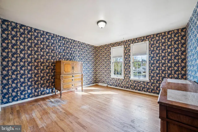 a view of an empty room and wooden floor
