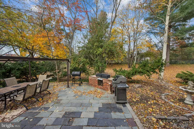 a view of a patio with table and chairs and couches