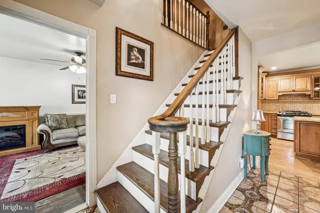 a view of entryway livingroom and hall with wooden floor