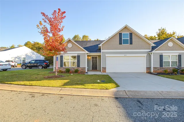 a view of house with yard and swimming pool
