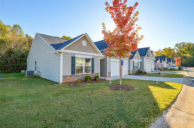 a house with lots of trees in the background