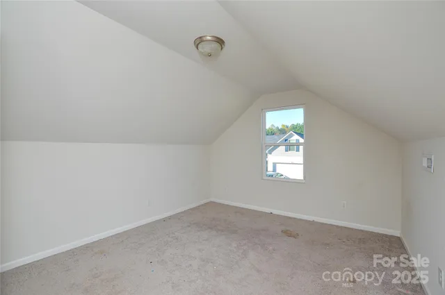 a view of a house with a yard and deck