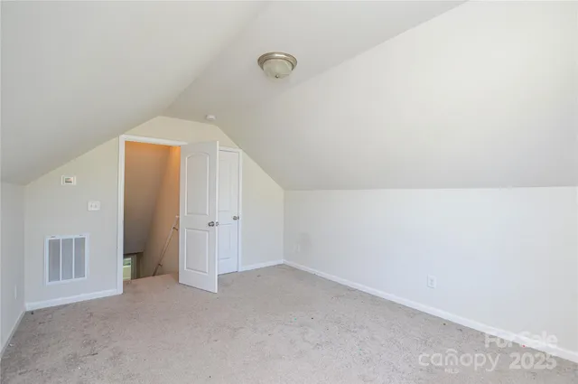a view of a house with a wooden deck