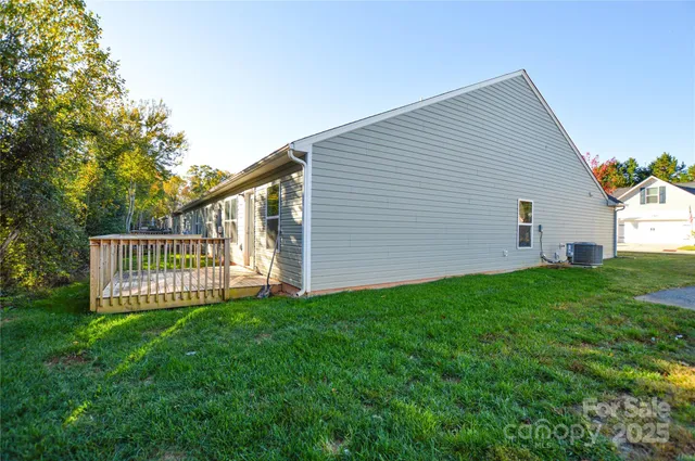 a view of backyard with deck and wooden floor