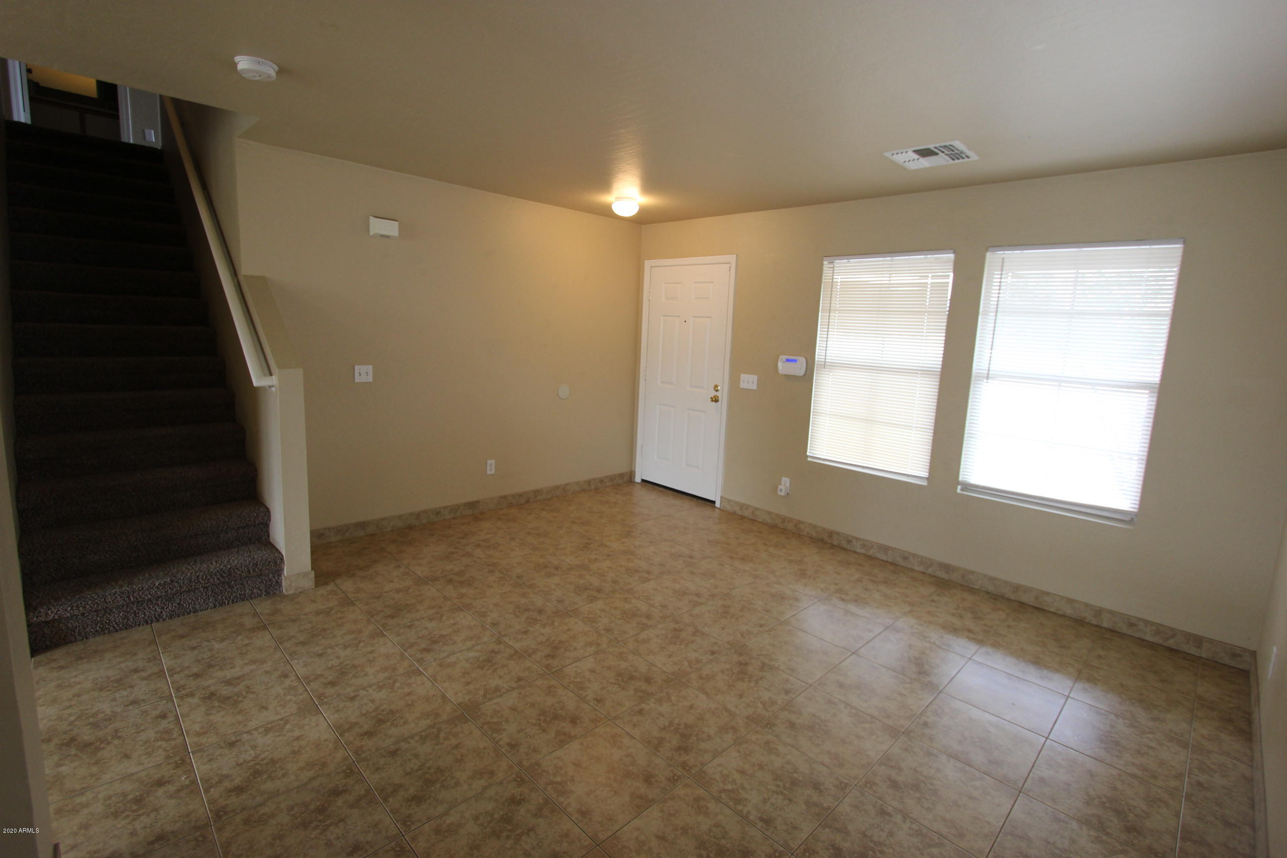 3125 West Fremont Rd. Phoenix, AZ 85041 - Photo 17 of 33 a view of an empty room with a window