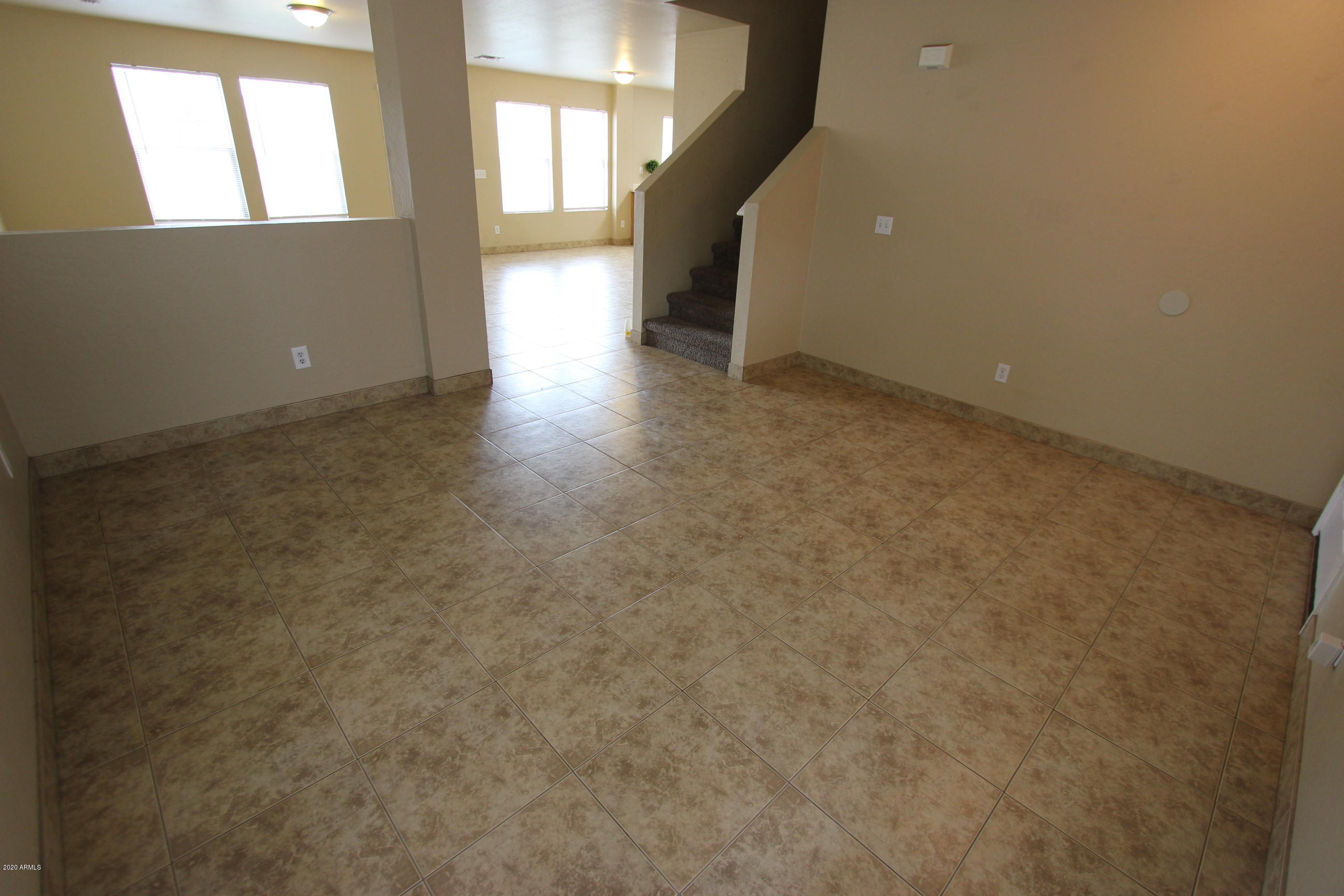 3125 West Fremont Rd. Phoenix, AZ 85041 - Photo 18 of 33 a view of an empty room with a fireplace