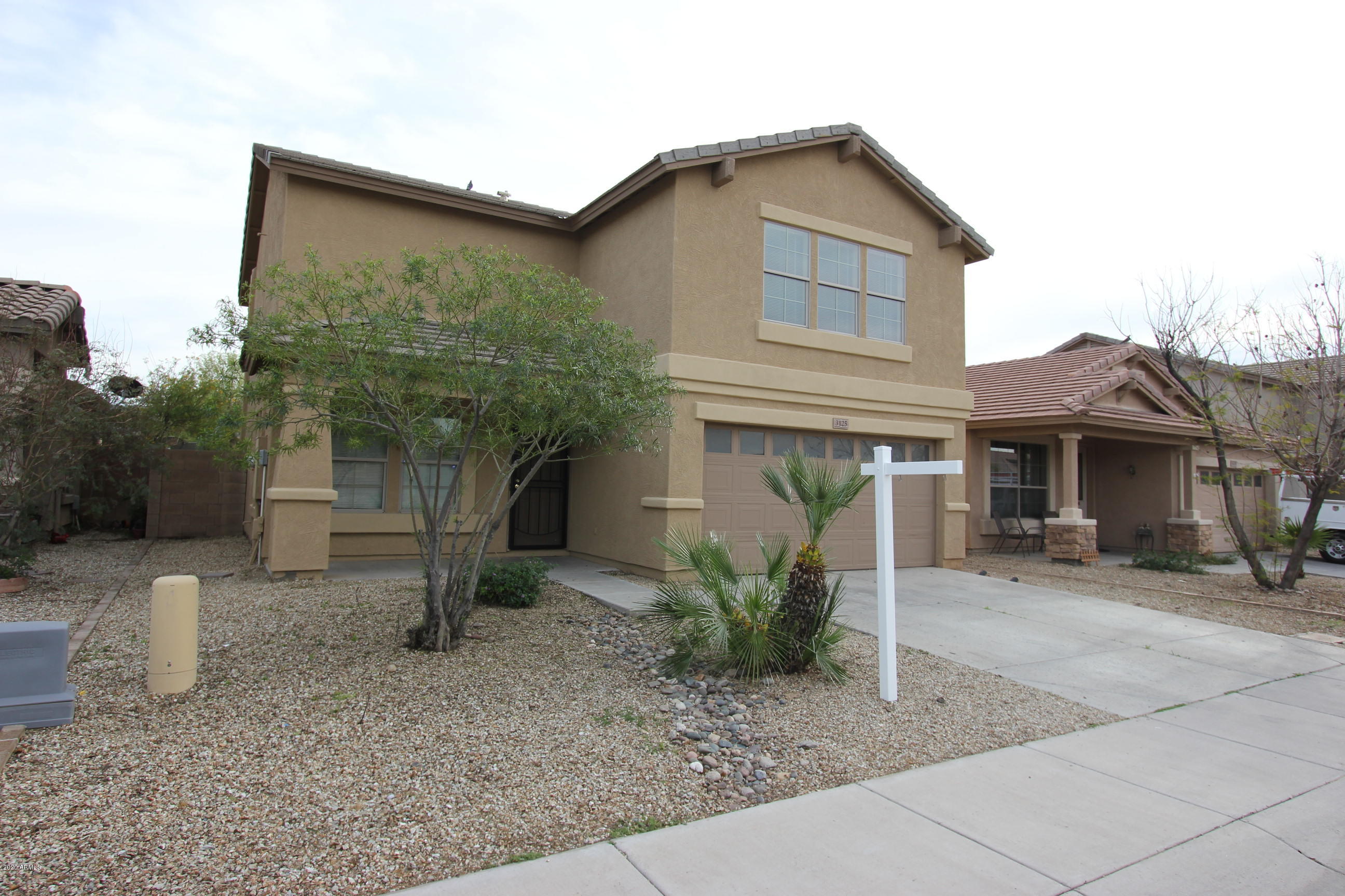 3125 West Fremont Rd. Phoenix, AZ 85041 - Photo 2 of 33 a front view of a house with garden