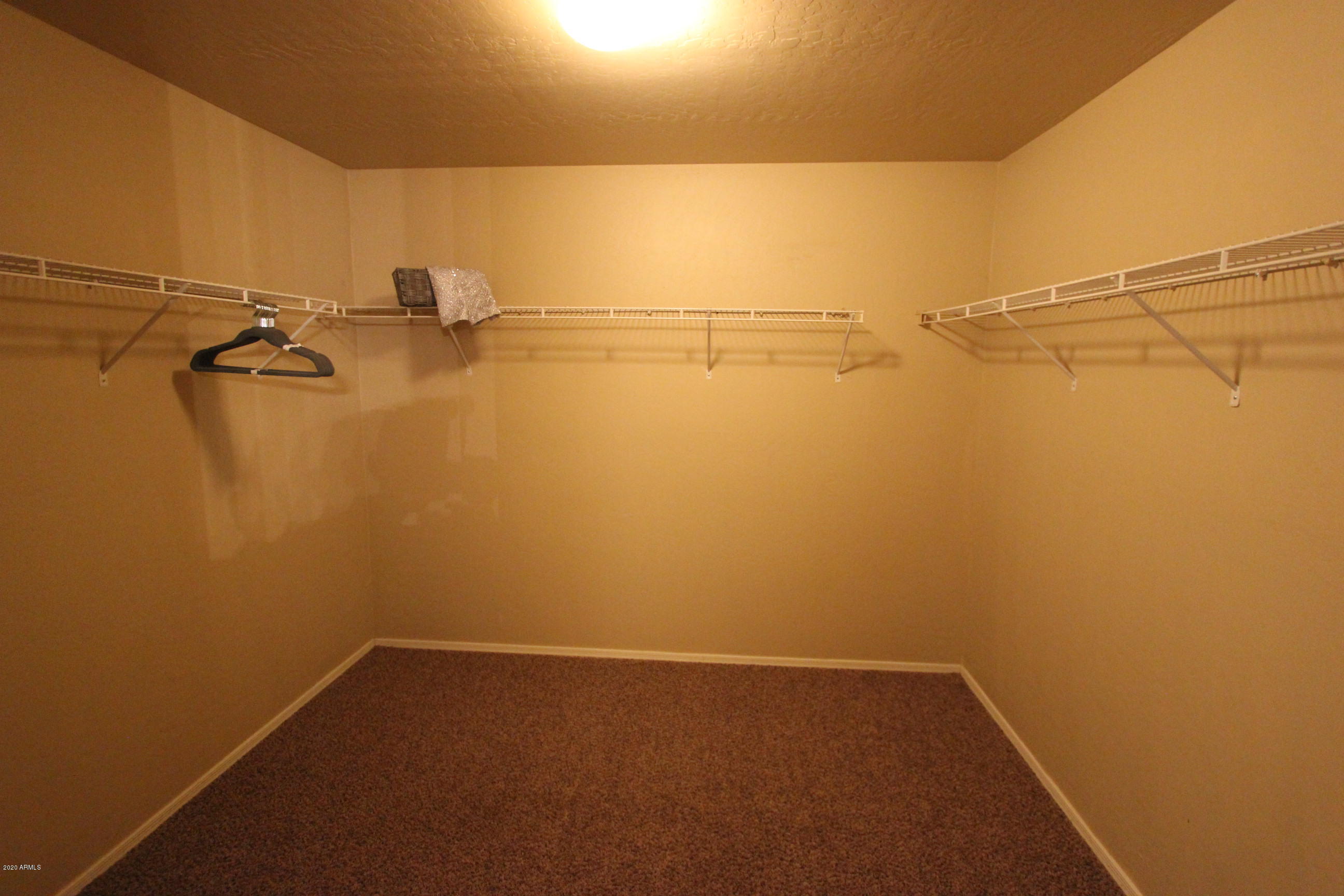 3125 West Fremont Rd. Phoenix, AZ 85041 - Photo 22 of 33 a view of a room with racks on the wall