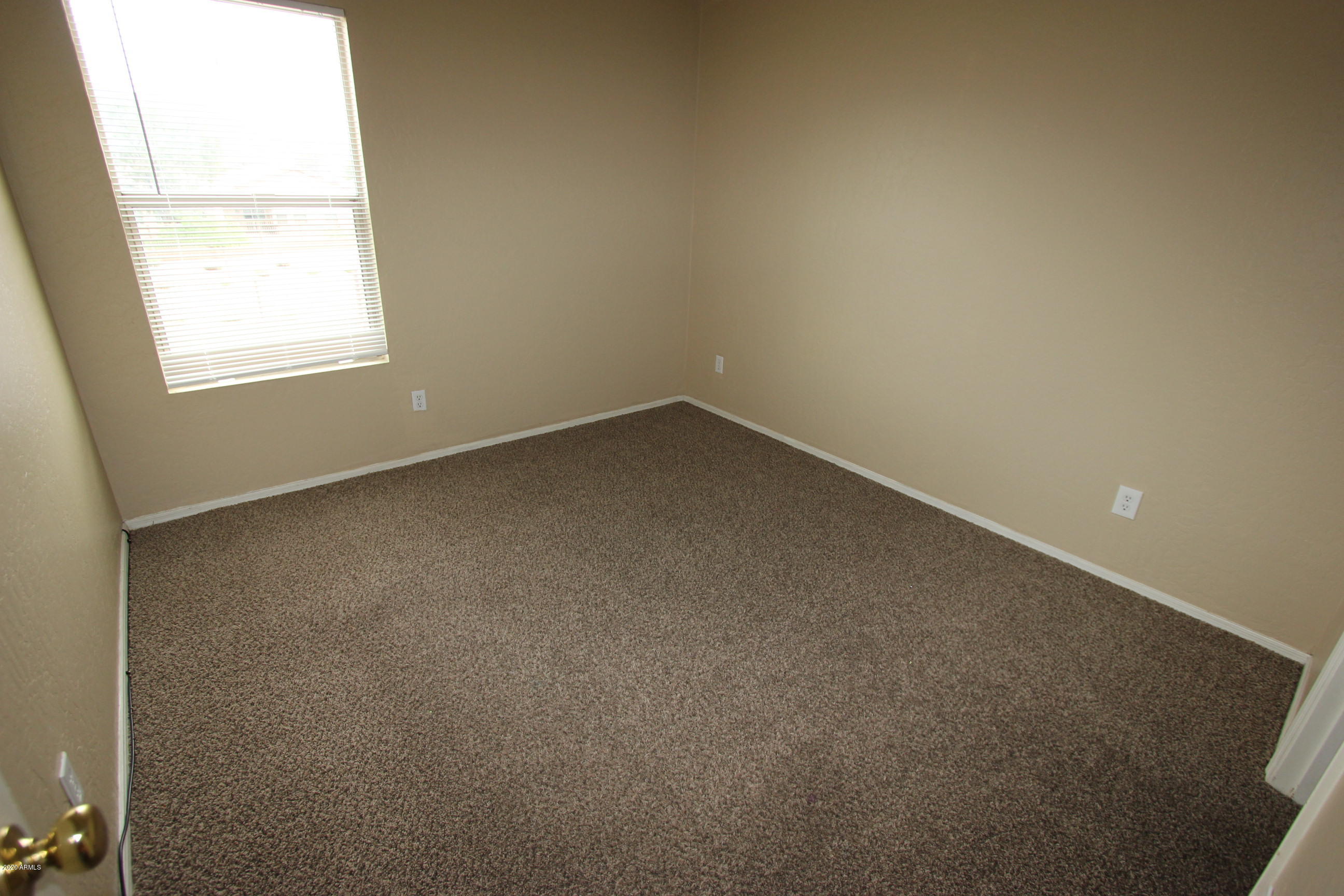 3125 West Fremont Rd. Phoenix, AZ 85041 - Photo 28 of 33 an empty room with a window