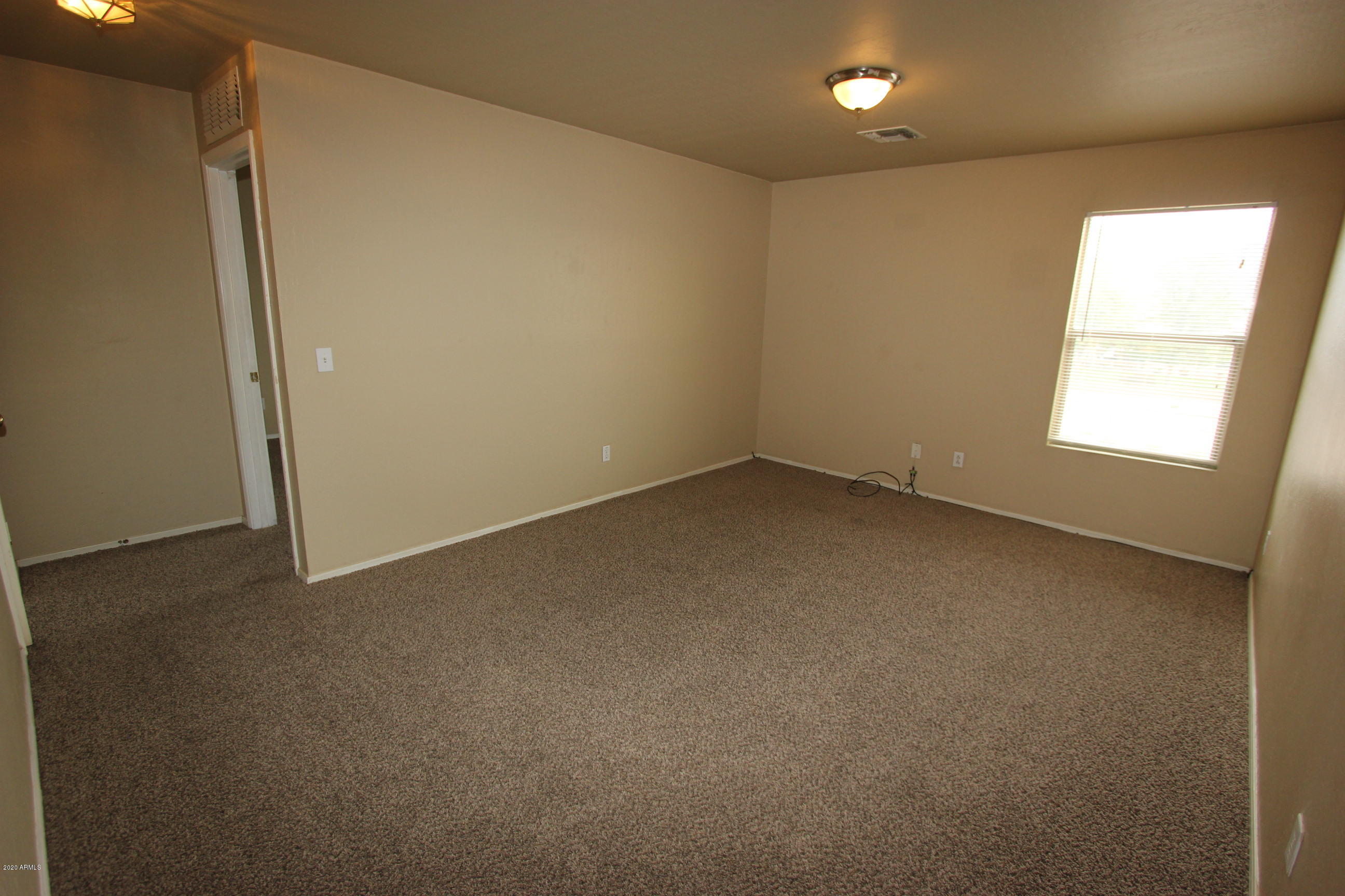 3125 West Fremont Rd. Phoenix, AZ 85041 - Photo 29 of 33 an empty room with a window