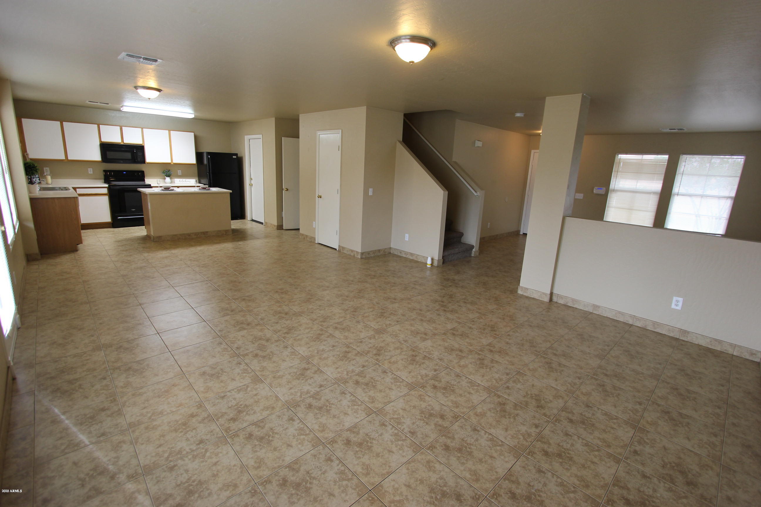 3125 West Fremont Rd. Phoenix, AZ 85041 - Photo 3 of 33 a view of a kitchen with furniture and a refrigerator