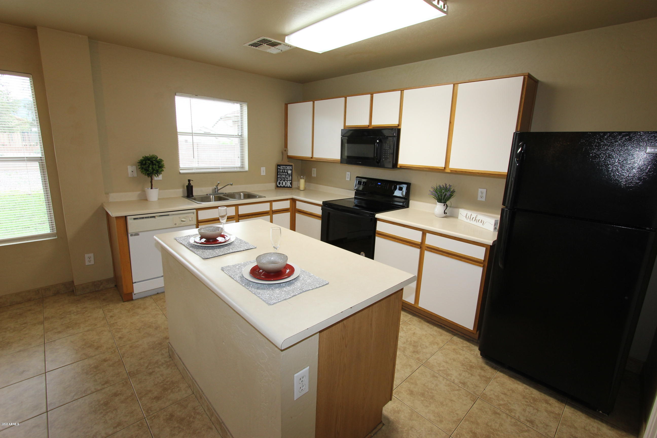 3125 West Fremont Rd. Phoenix, AZ 85041 - Photo 8 of 33 a kitchen that has a sink a window and appliances