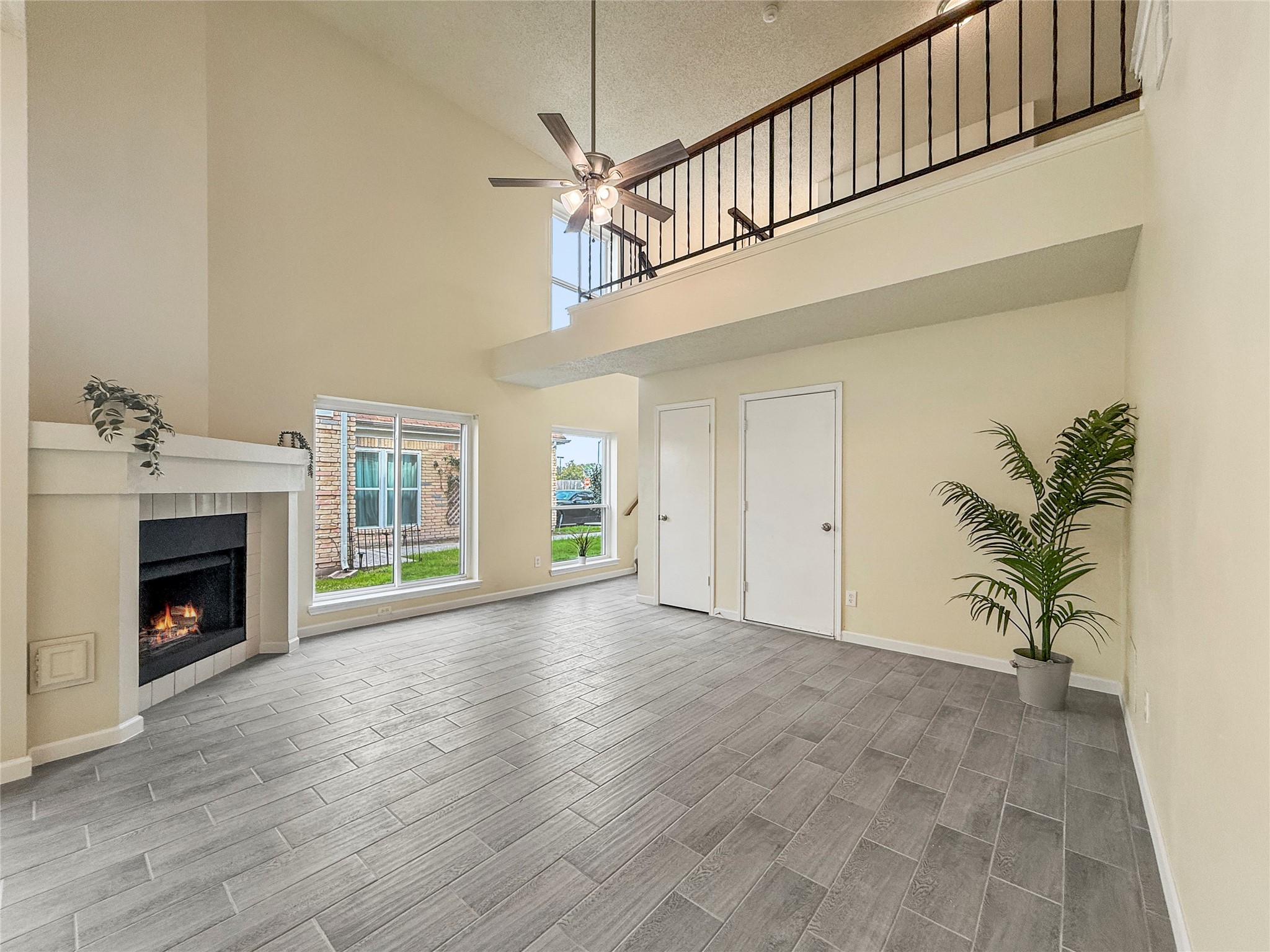 13635 Repa Lane Houston, TX 77014 - Photo 11 of 49 a view of empty room with wooden floor and a fireplace