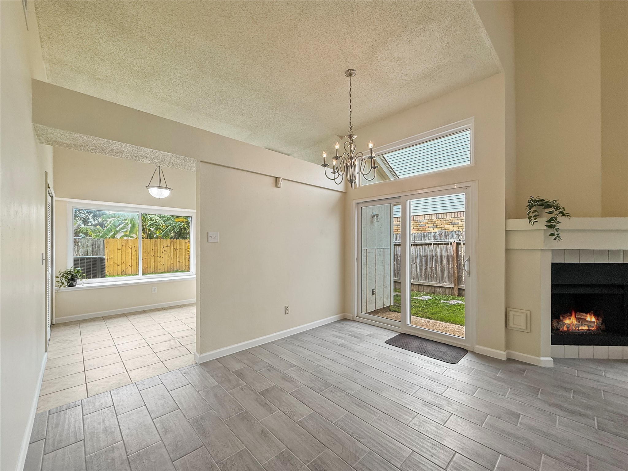 13635 Repa Lane Houston, TX 77014 - Photo 14 of 49 a view of an empty room with a window and fireplace