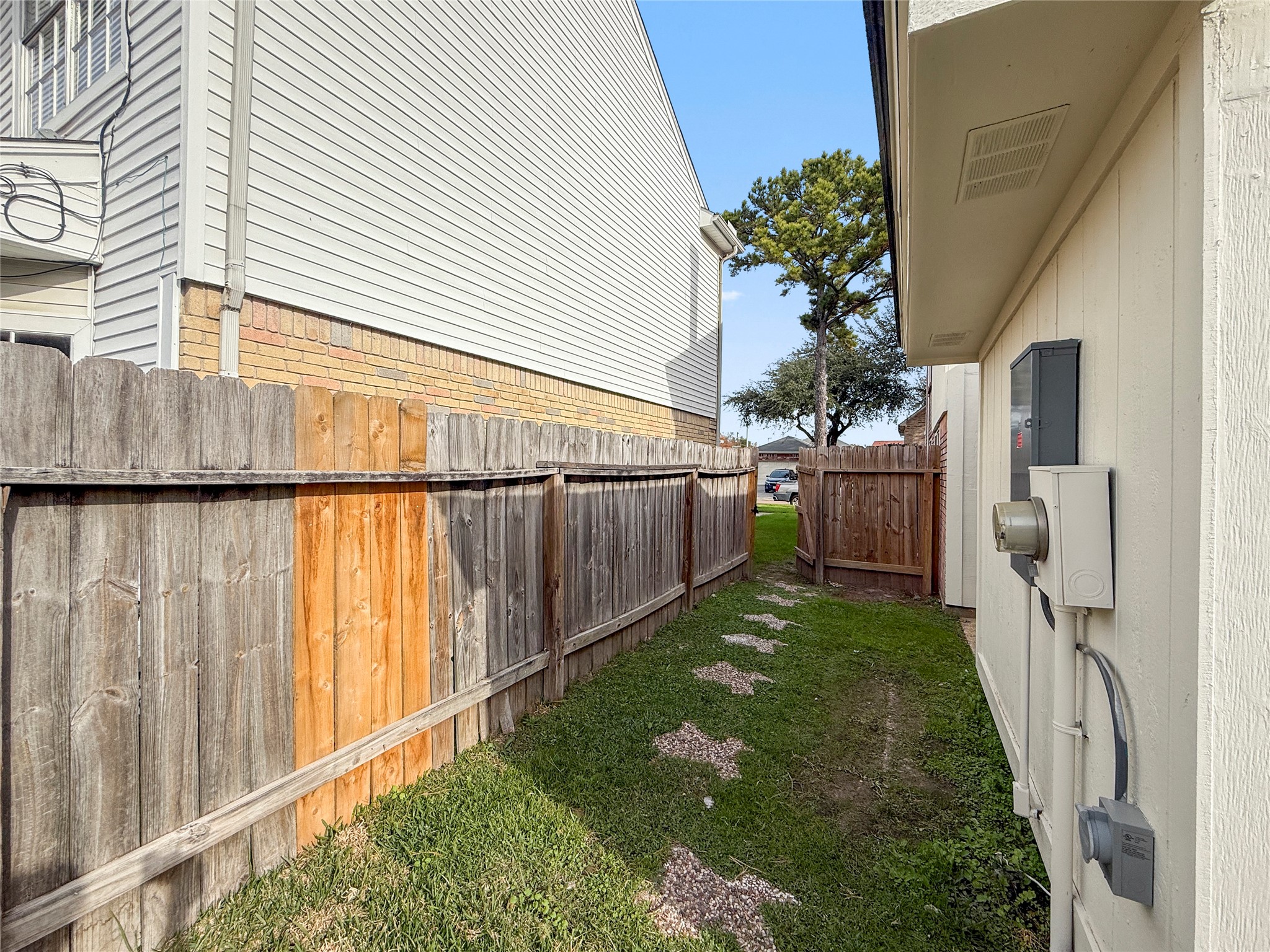 13635 Repa Lane Houston, TX 77014 - Photo 17 of 49 Over the Texas-shaped tiles you can go from the front to the back of the house, without getting muddy feet during rainy periods.