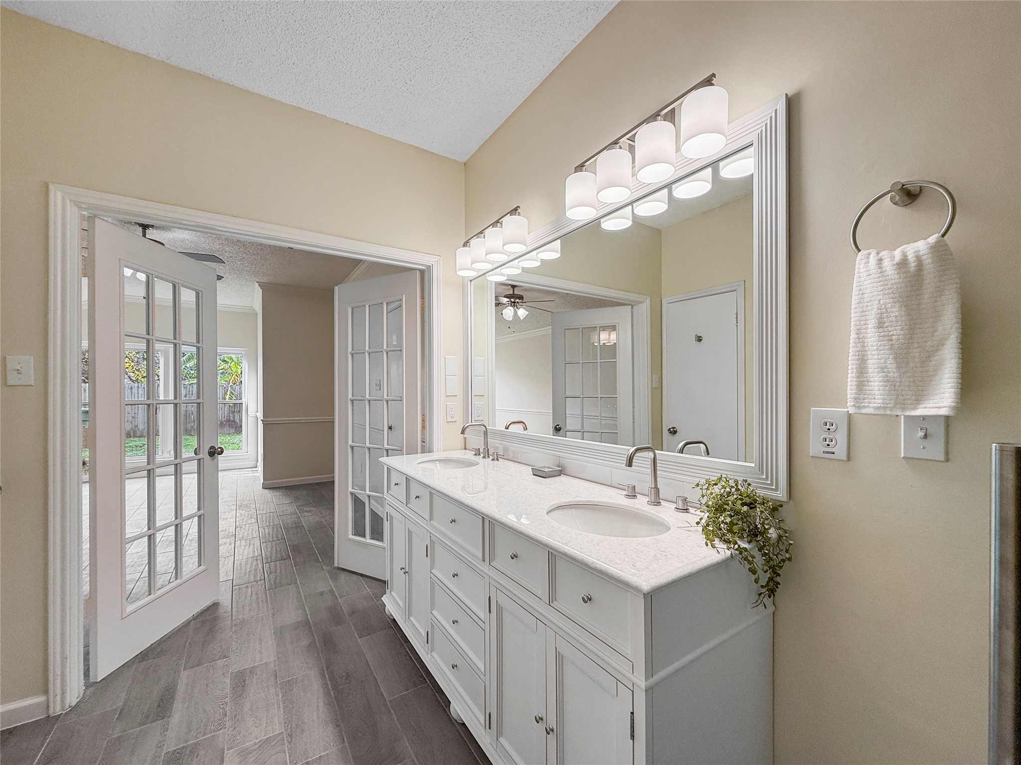 13635 Repa Lane Houston, TX 77014 - Photo 31 of 50 This bright bathroom also features a large mirror and modern lighting.