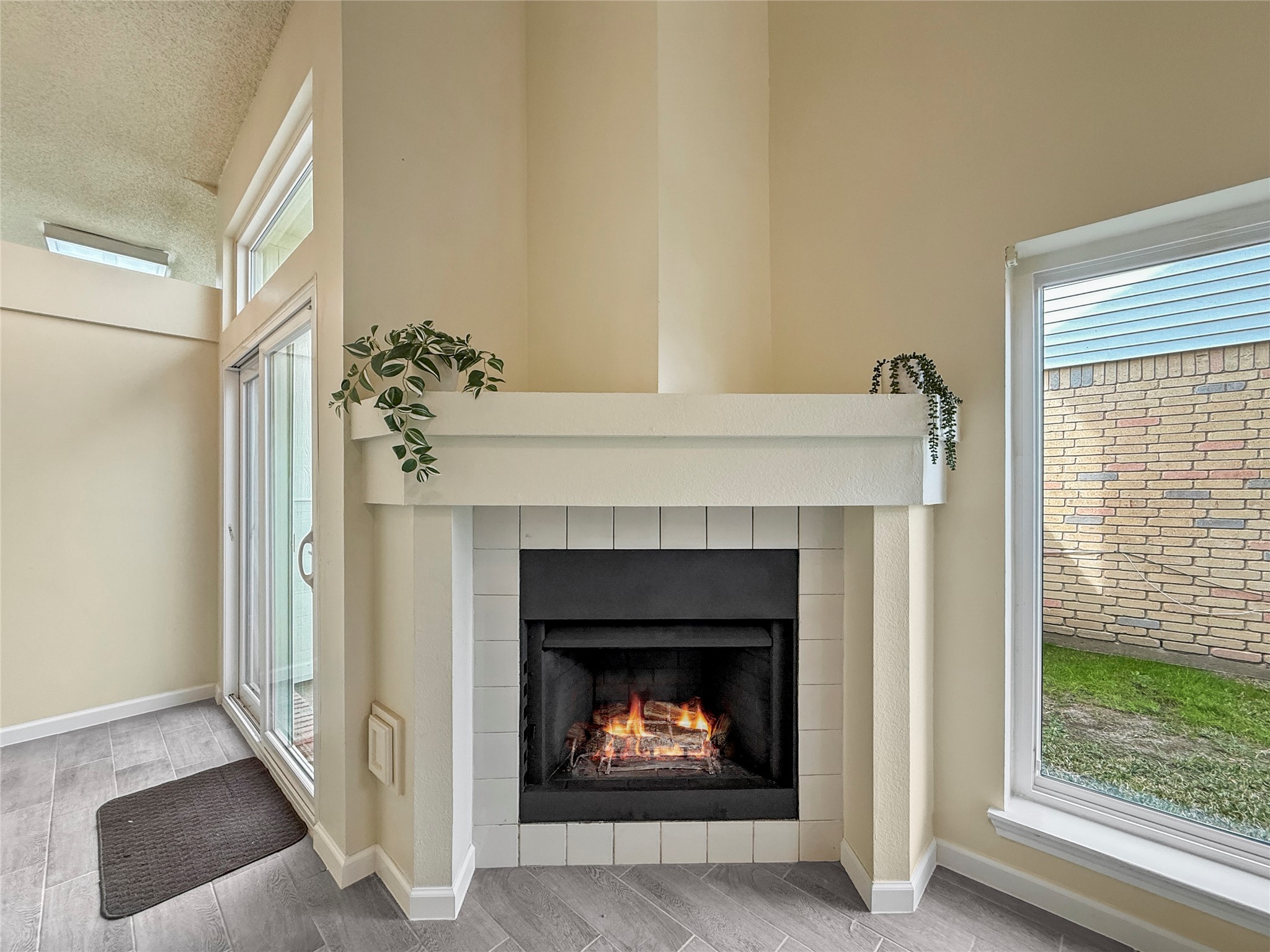 13635 Repa Lane Houston, TX 77014 - Photo 8 of 49 Cozy corner with a modern fireplace, featuring a sleek mantel for the rare chilly Texan days.