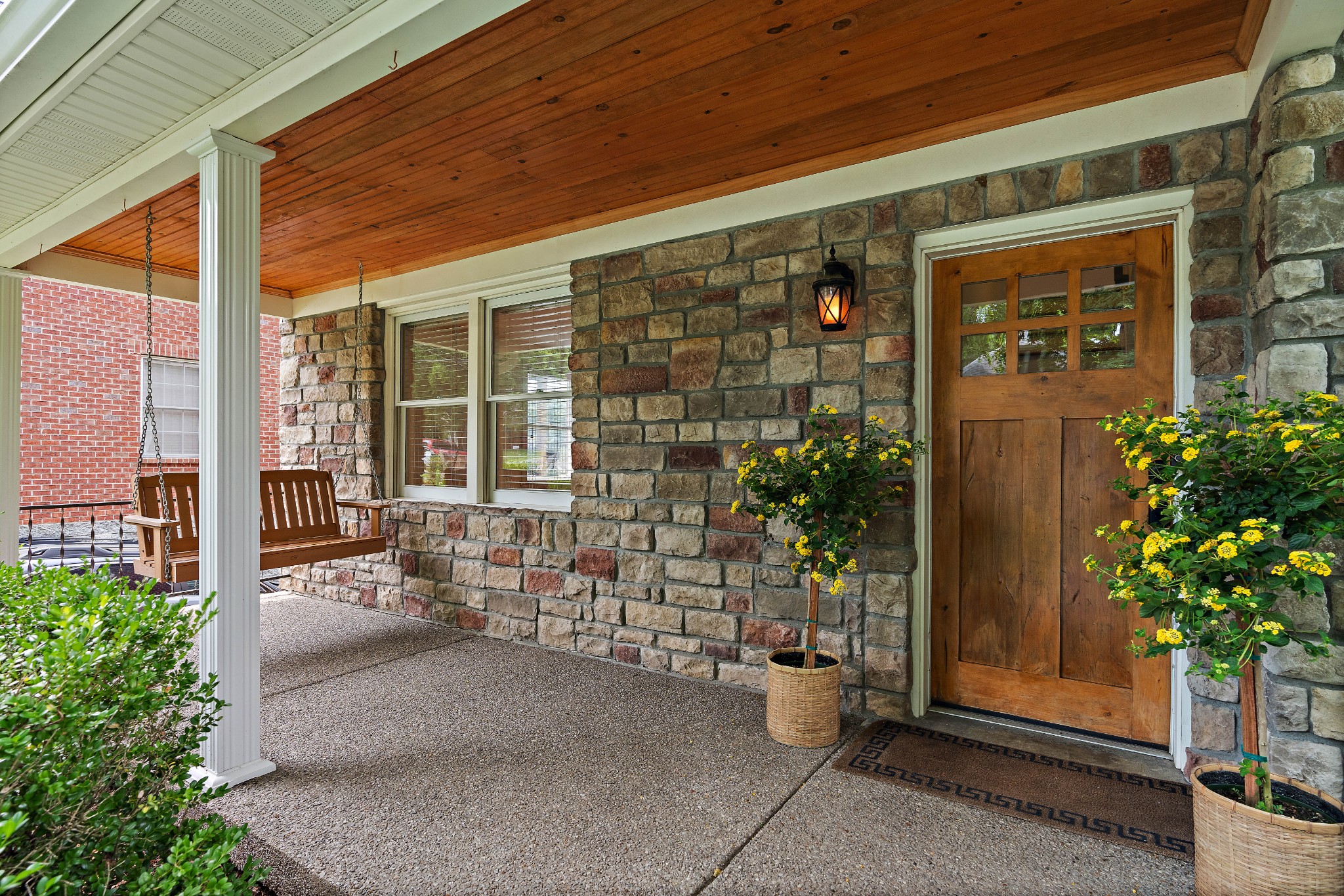 a couple of potted plants in front of building